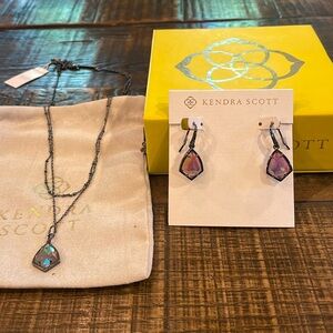 Kendra Scott earring and double strand necklace.